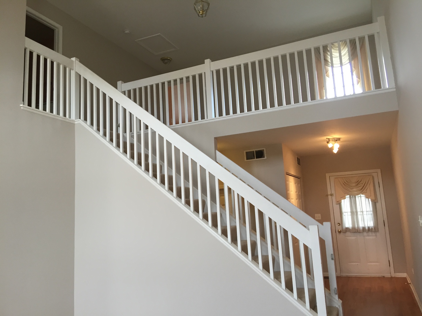 1499 Keystone Court, Unit 423 Elgin, IL 60120 - Photo 6 of 18 a view of staircase with railing and a floor to ceiling window
