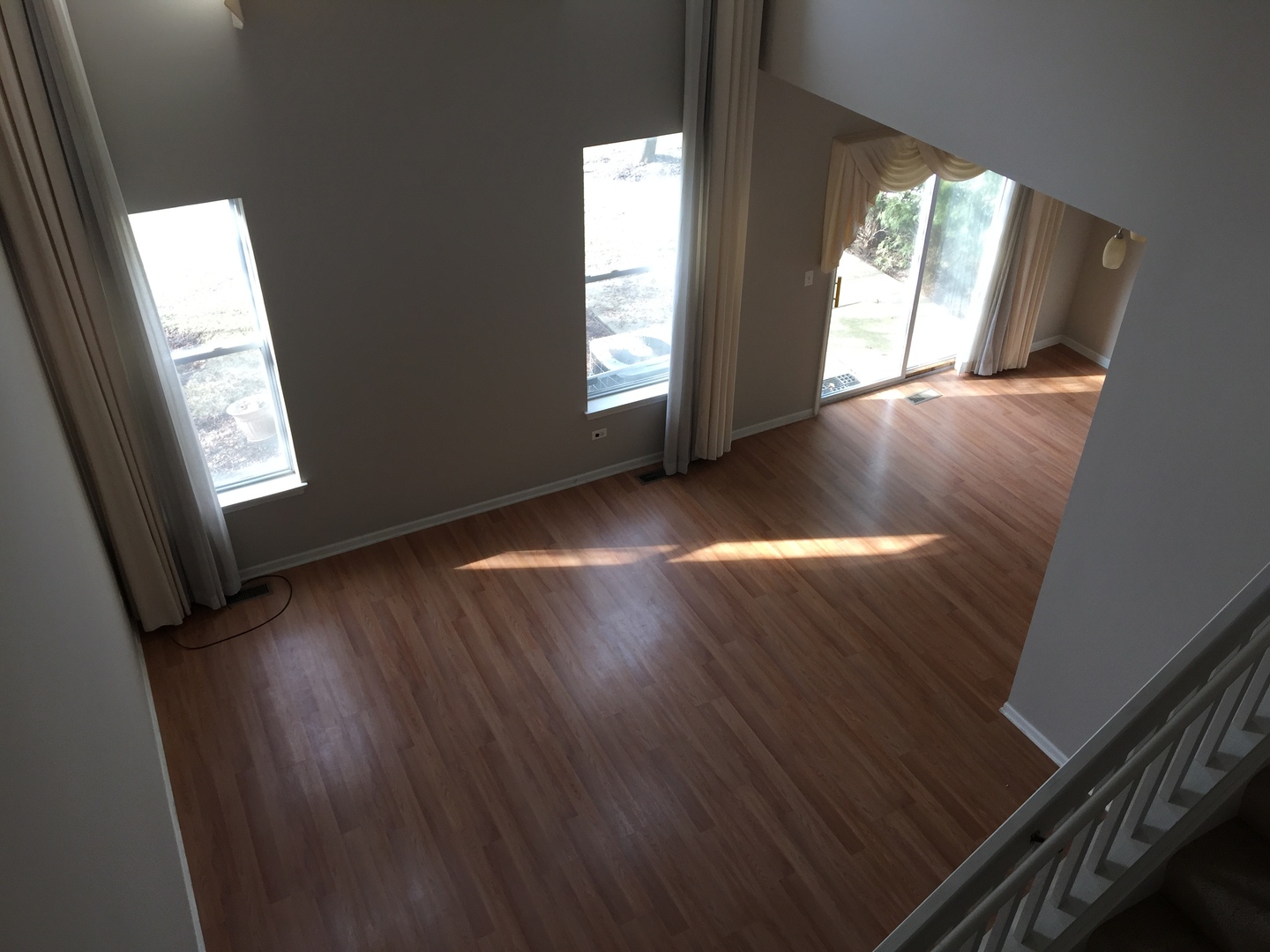 1499 Keystone Court, Unit 423 Elgin, IL 60120 - Photo 9 of 18 an empty room with wooden floor and windows