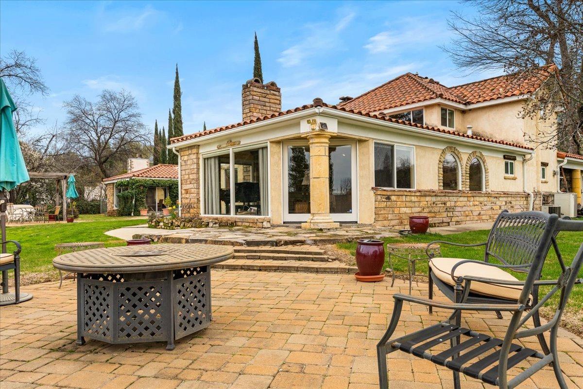 6525 Curtola Ranch Road Auburn, CA 95602 - Photo 18 of 49 Walk out patio from the Living Room with views of the Pond and hills