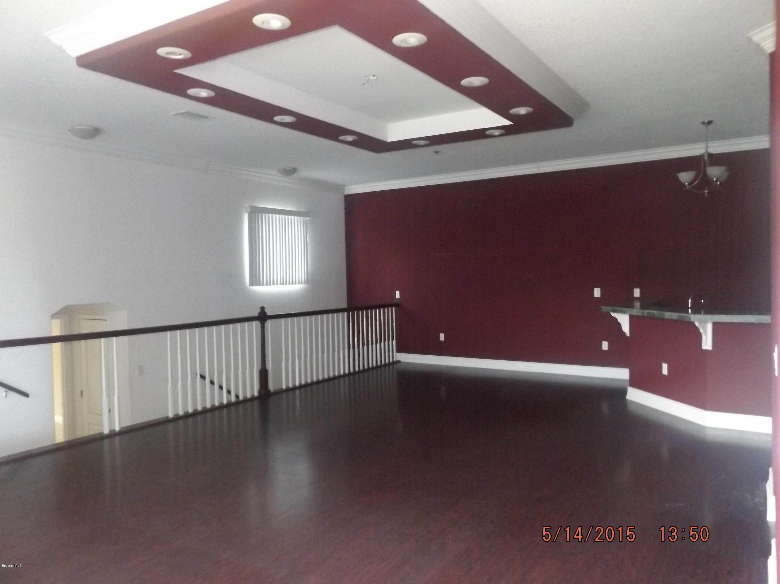 3201 Aurora Road Melbourne, FL 32934 - Photo 11 of 18 a view of an empty room with windows
