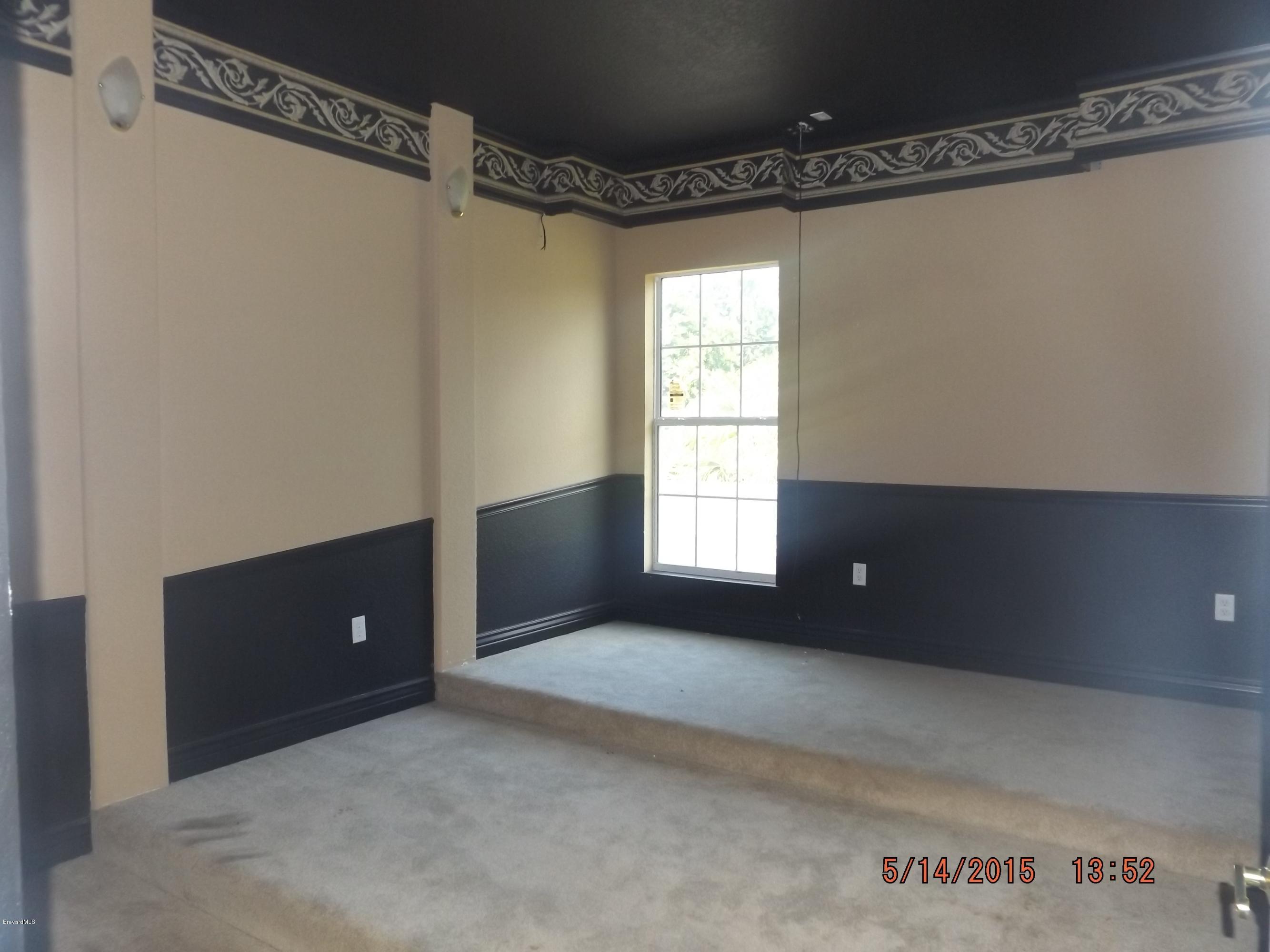 3201 Aurora Road Melbourne, FL 32934 - Photo 12 of 18 a view of an empty room with a window