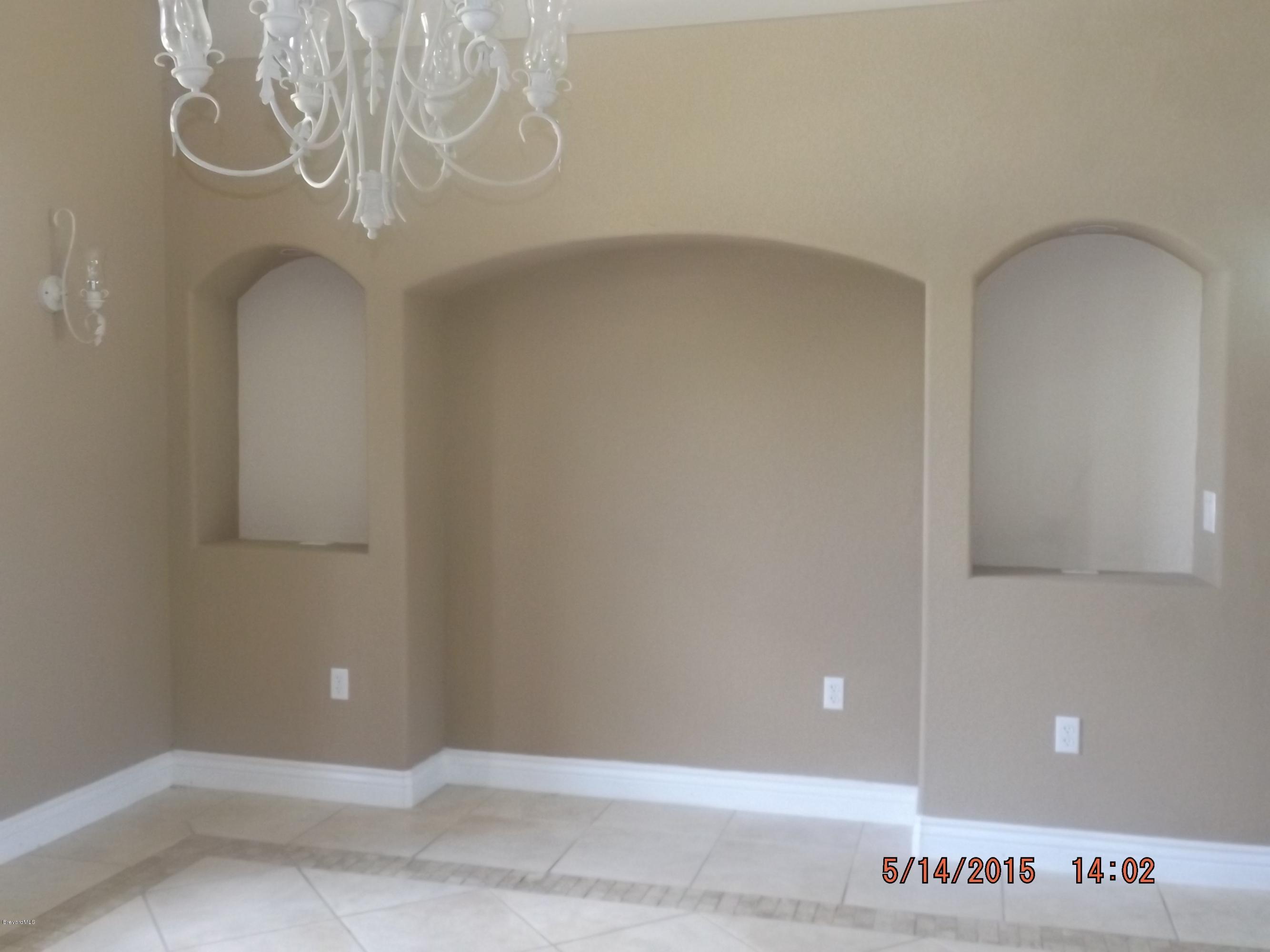 3201 Aurora Road Melbourne, FL 32934 - Photo 4 of 18 a view of a door in the room