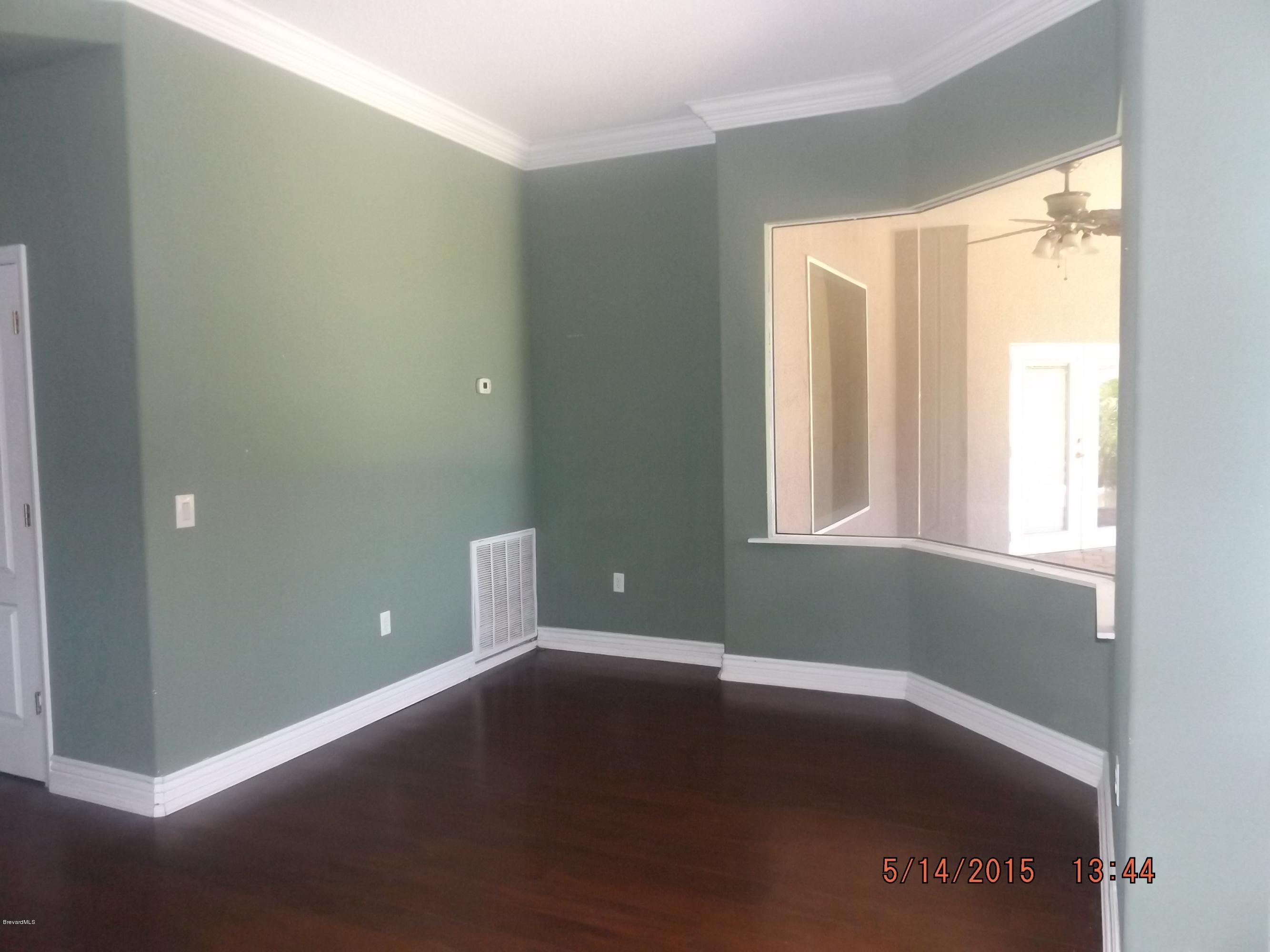 3201 Aurora Road Melbourne, FL 32934 - Photo 6 of 18 a view of an empty room with a window