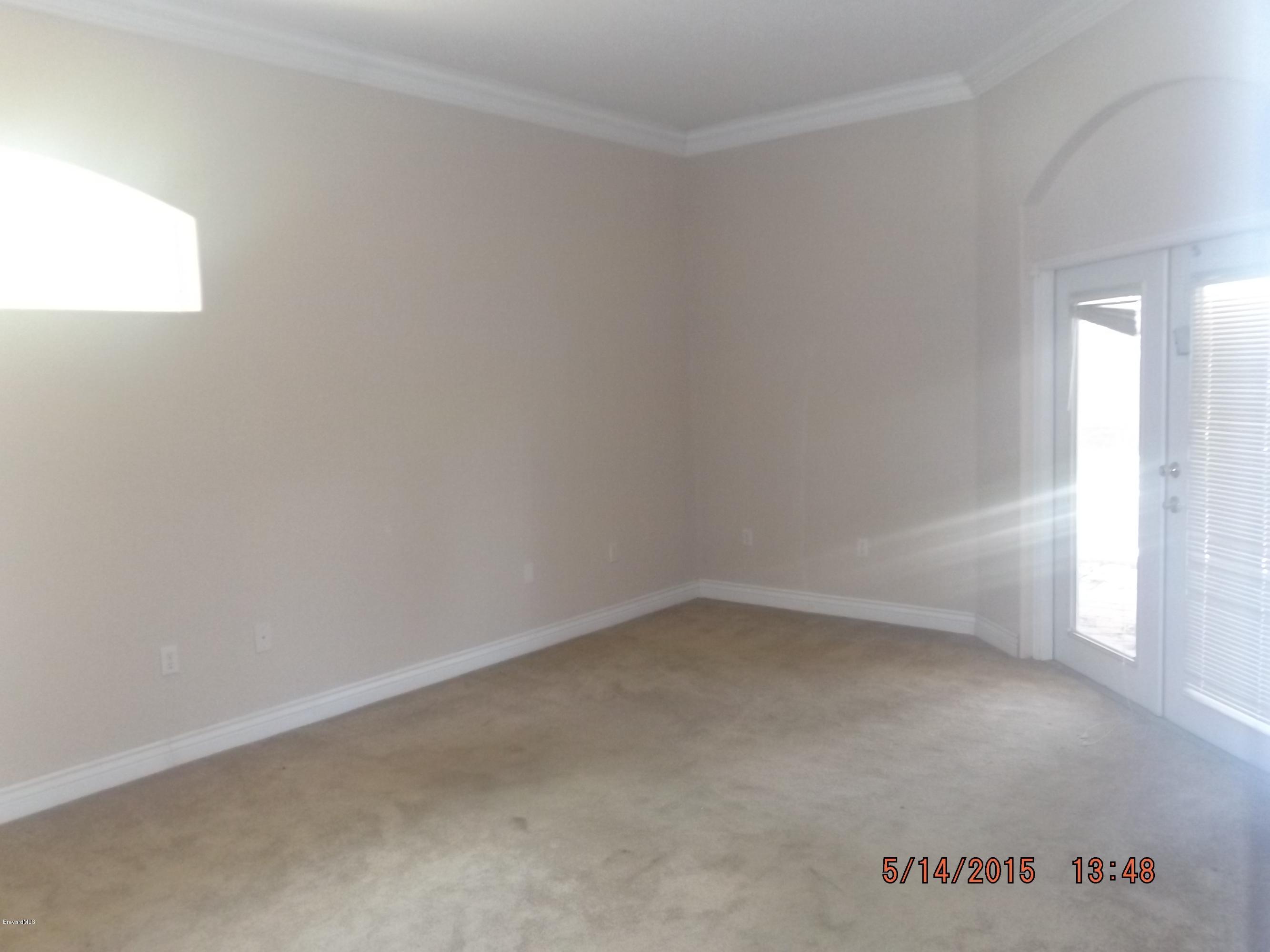 3201 Aurora Road Melbourne, FL 32934 - Photo 8 of 18 an empty room with a window