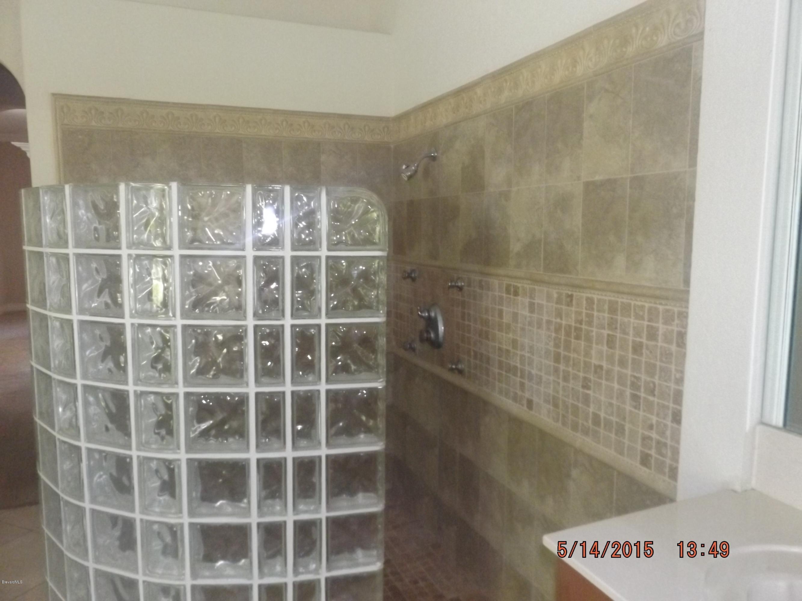 3201 Aurora Road Melbourne, FL 32934 - Photo 10 of 18 a view of a bathroom with a shower