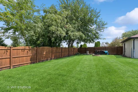 a view of a backyard with a small cabin