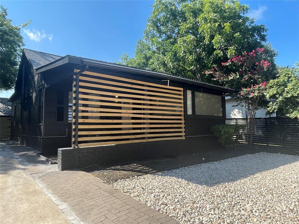 1403 Newfield Lane Austin, TX 78703 - Photo 1 of 34 a backyard of a house with lots of green space