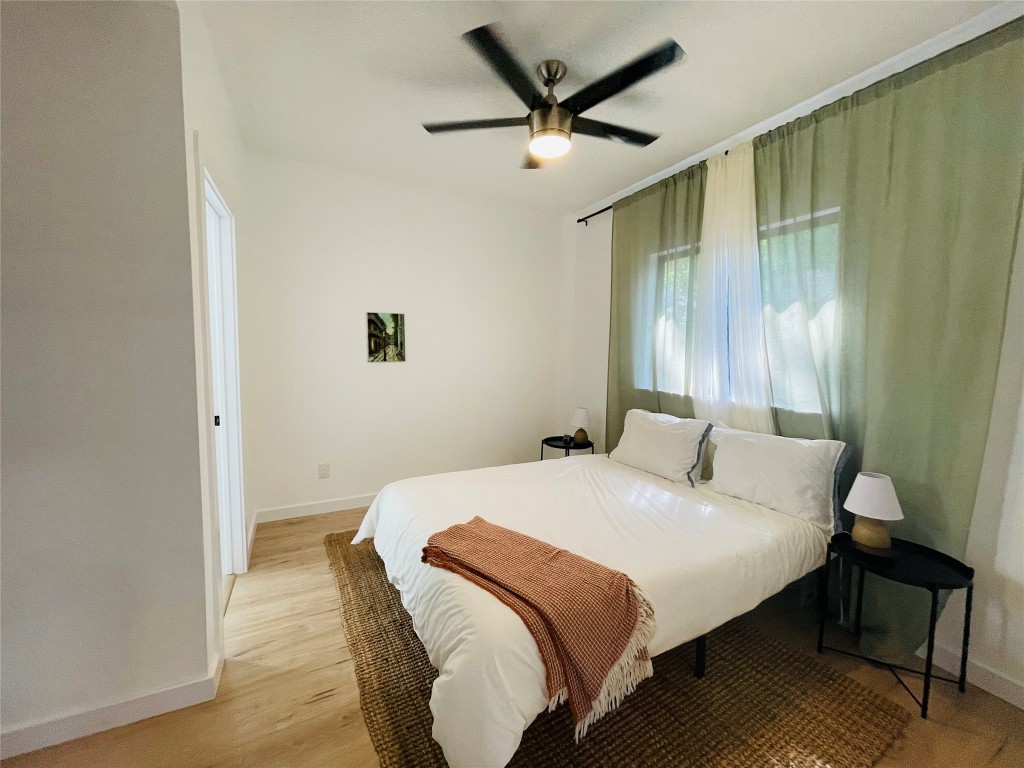 1403 Newfield Lane Austin, TX 78703 - Photo 30 of 34 a bedroom with a bed and a window