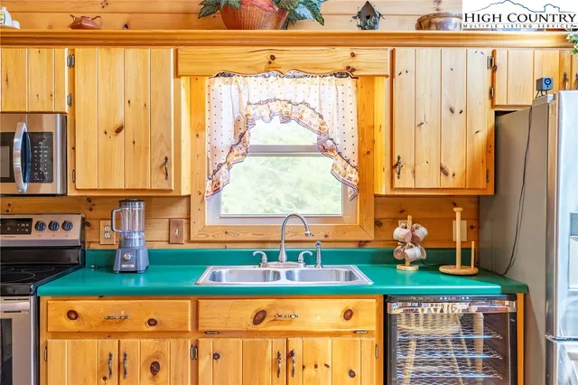 a kitchen with stainless steel appliances a counter place and a table