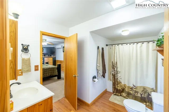 a en suite bathroom with a sink and a mirror