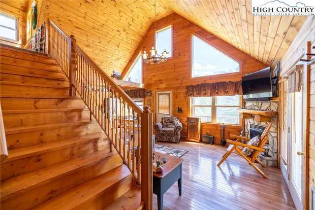 a view of outdoor living space with wooden floor and furniture