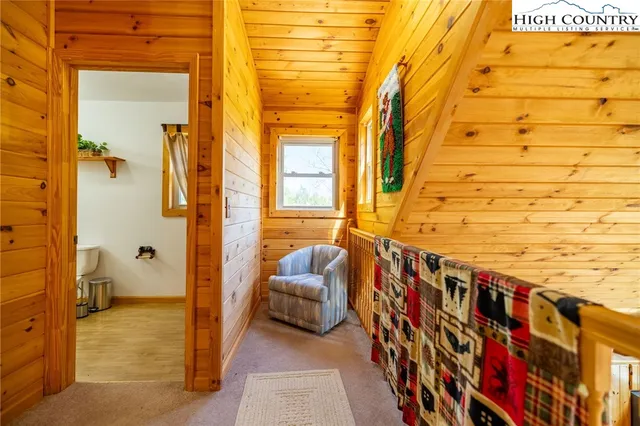 a bedroom with a bed and a night stand