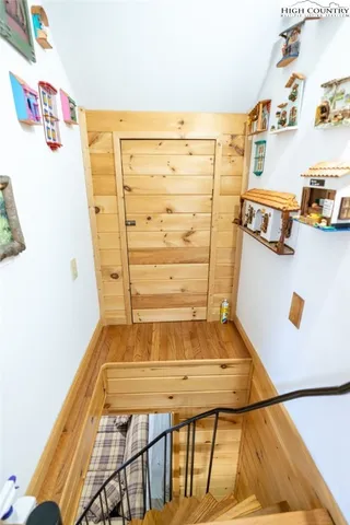 a reading room with furniture and a rug
