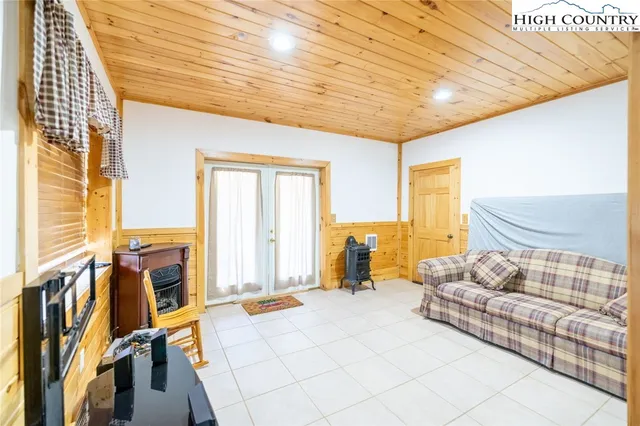 a bathroom with a sink a toilet and shower curtain