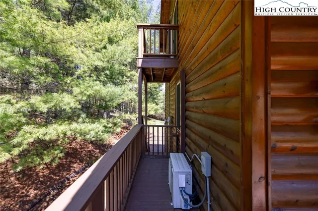 a view of balcony with wooden floor