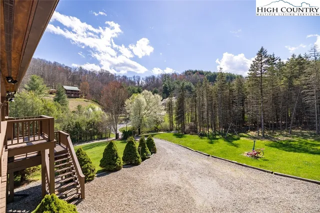 a view of a balcony with wooden floor