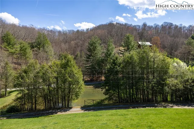 a view of a garden with a building in the background