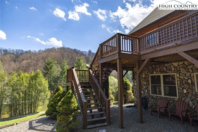 a view of a forest with a yard