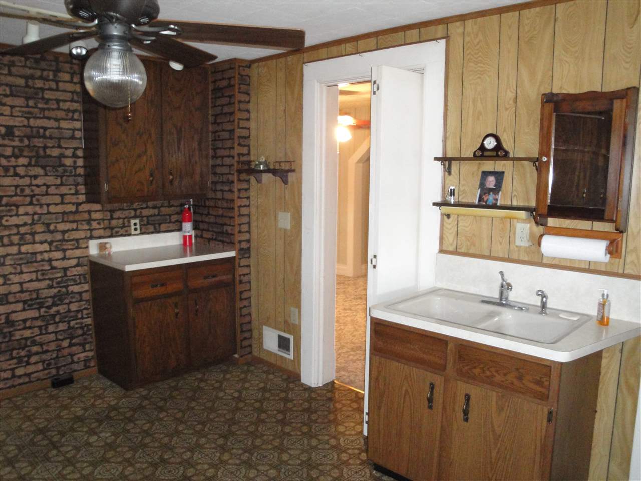 8005 Kishwaukee Road Stillman Valley, IL 61084 - Photo 4 of 12 a bathroom with a sink and a mirror