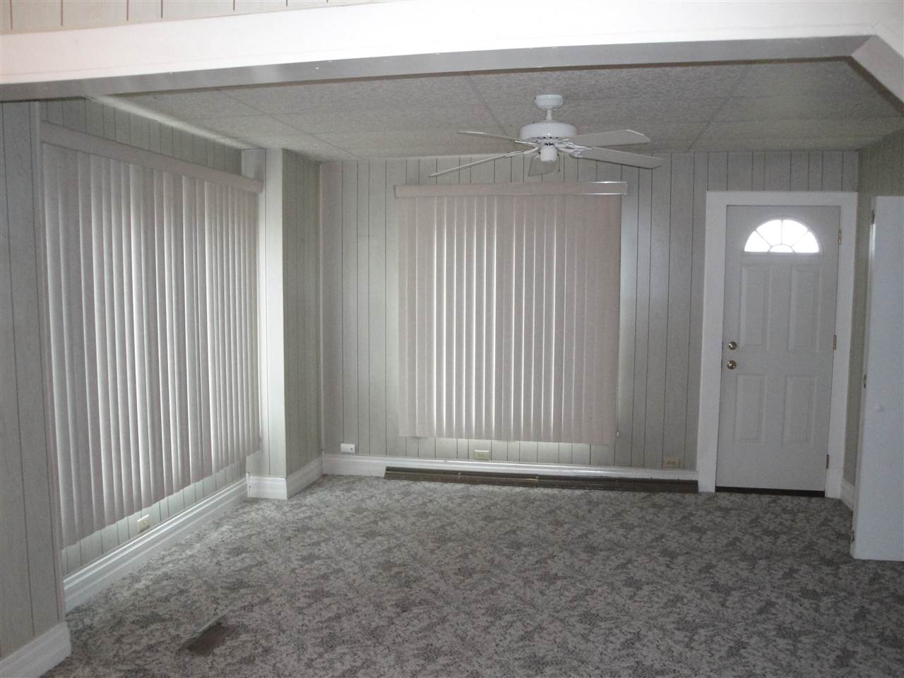 8005 Kishwaukee Road Stillman Valley, IL 61084 - Photo 5 of 12 an empty room with windows and entrance