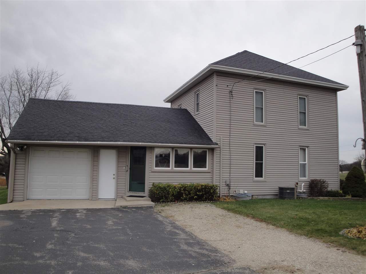 8005 Kishwaukee Road Stillman Valley, IL 61084 - Photo 7 of 12 front view of a house with a yard