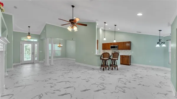 a kitchen with a sink stove and microwave