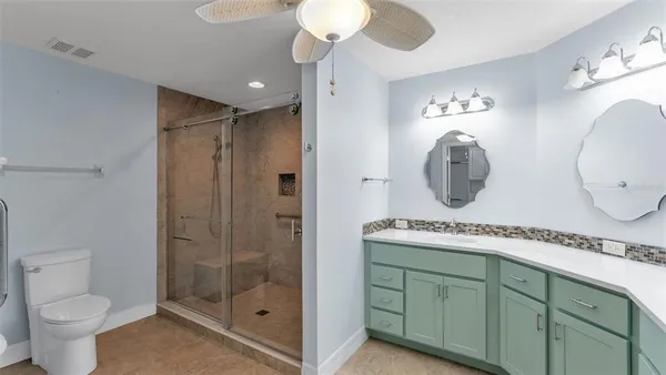 a bathroom with a double vanity sink and a mirror