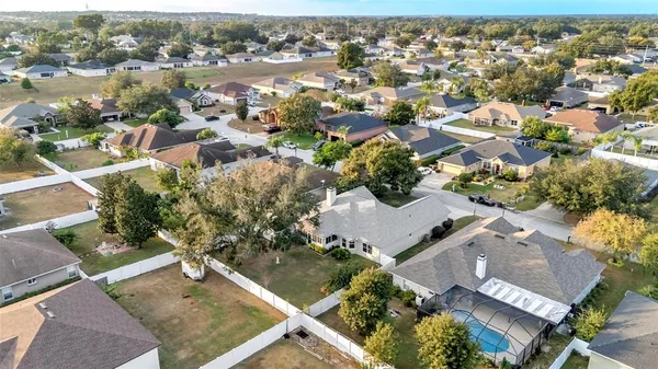 an aerial view of residential building with parking