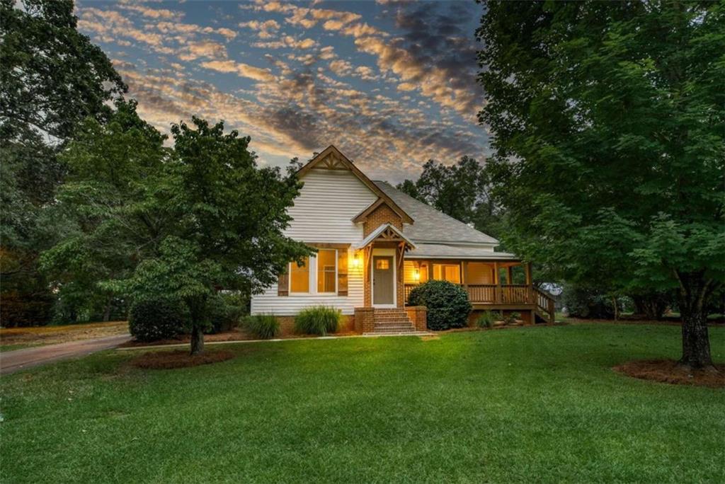4731 Brownwood Road Rutledge, GA 30663 - Photo 1 of 1 a front view of house with yard and green space
