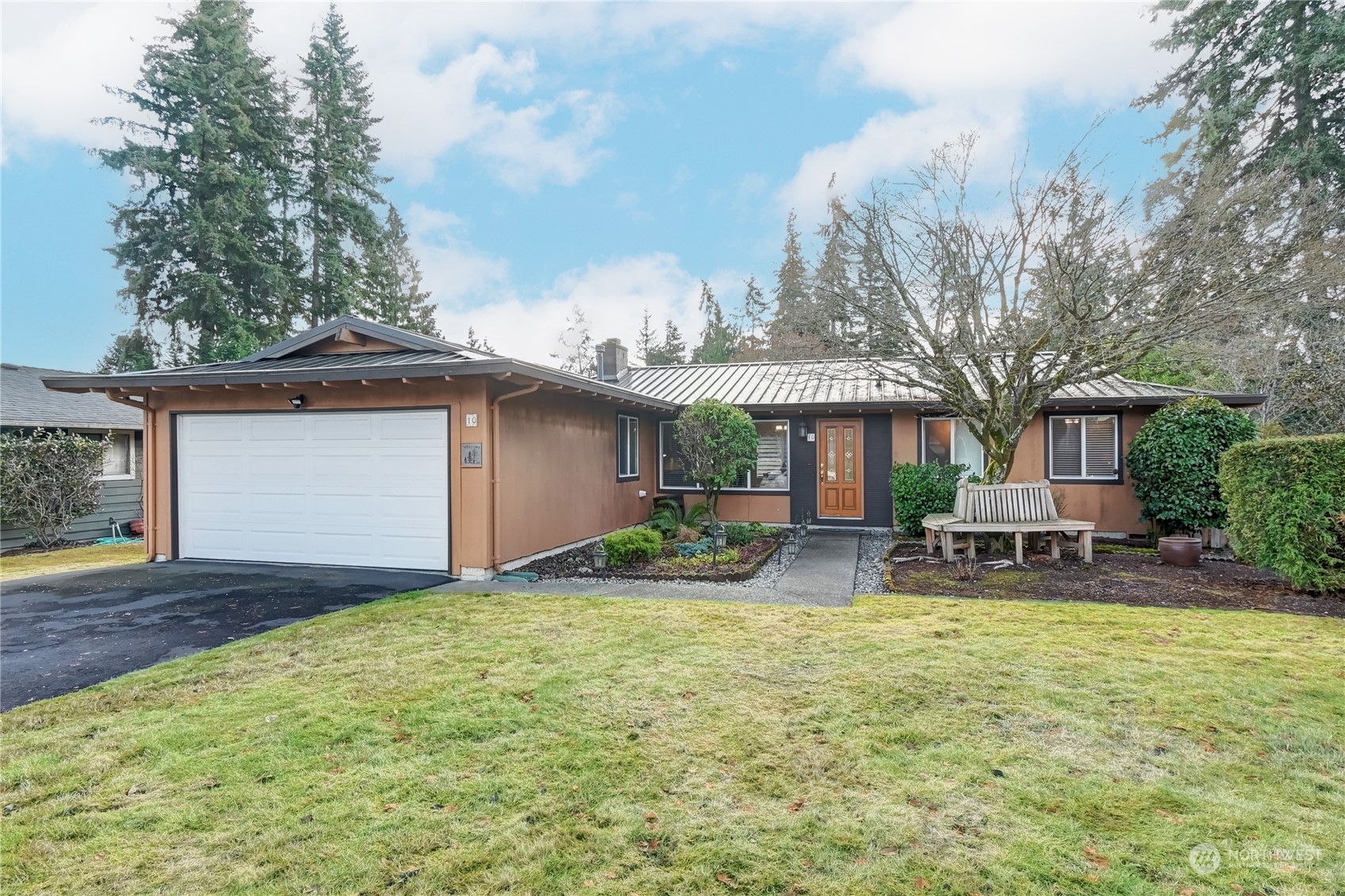 10 217th Place Southwest Bothell, WA 98021 - Photo 1 of 31 a backyard of a house with garden and patio