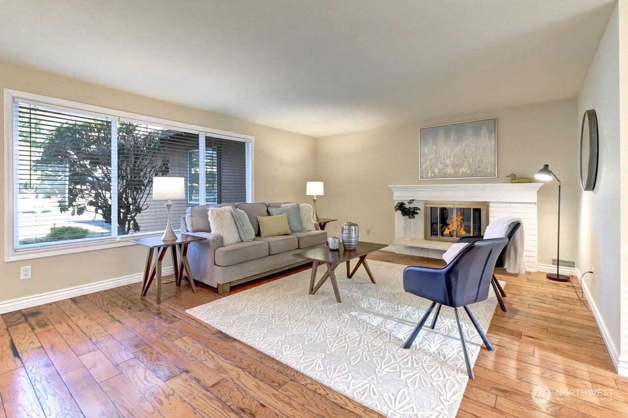 10 217th Place Southwest Bothell, WA 98021 - Photo 3 of 31 a living room with furniture and a fireplace