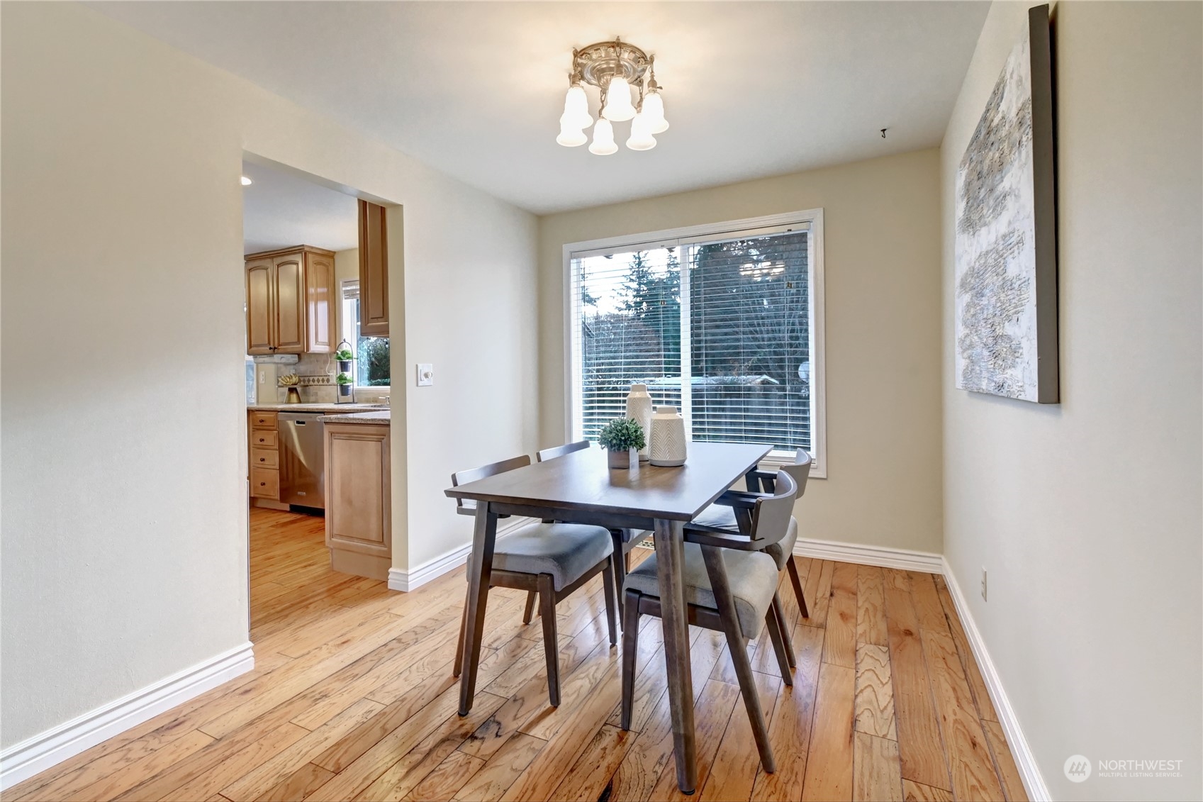 10 217th Place Southwest Bothell, WA 98021 - Photo 6 of 31 a view of a dining room with furniture window and wooden floor