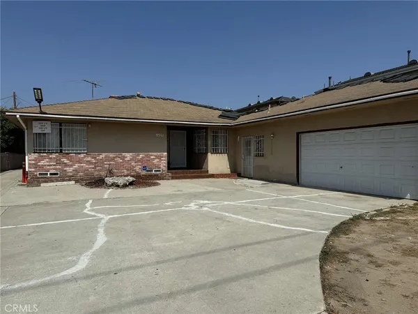 a front view of a house with garage