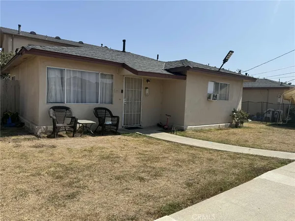 a view of a backyard of a house