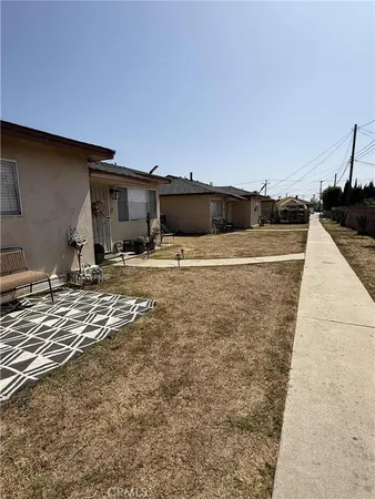 a view of a backyard of the house