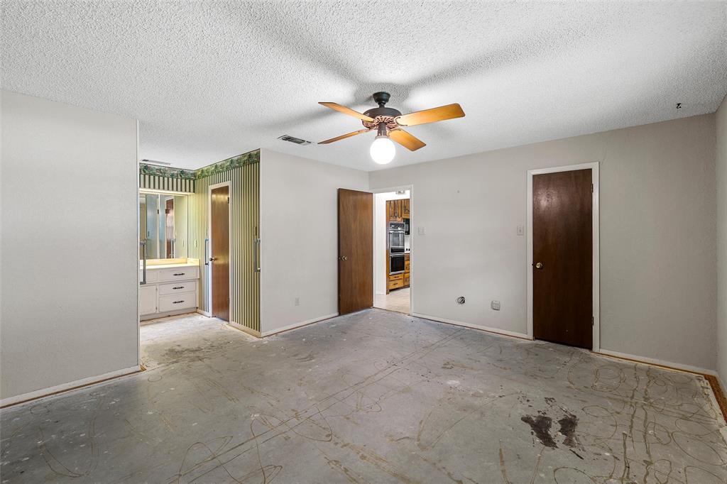 219 Opal Street Hewitt, TX 76643 - Photo 17 of 28 a view of a big room with closet and a ceiling fan