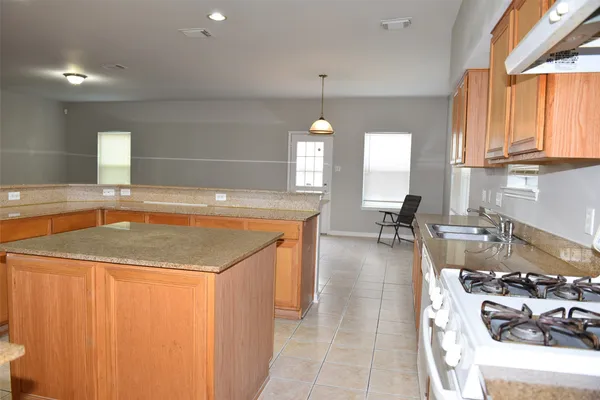 a very nice looking kitchen with a large window