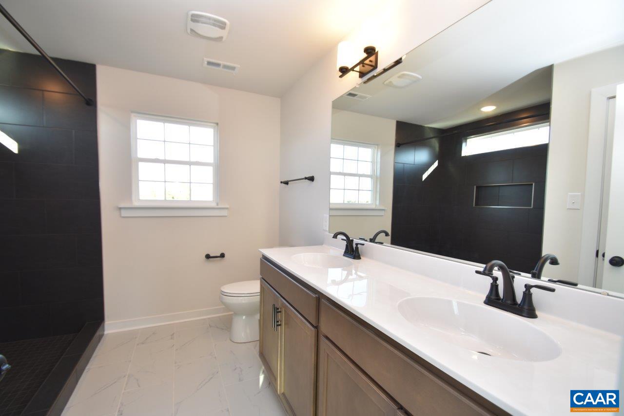 71 Riva Way Palmyra, VA 22963 - Photo 18 of 26 a bathroom with 2 sink and a mirror