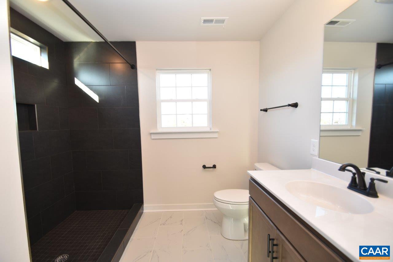 71 Riva Way Palmyra, VA 22963 - Photo 19 of 26 a bathroom with a sink toilet and vanity