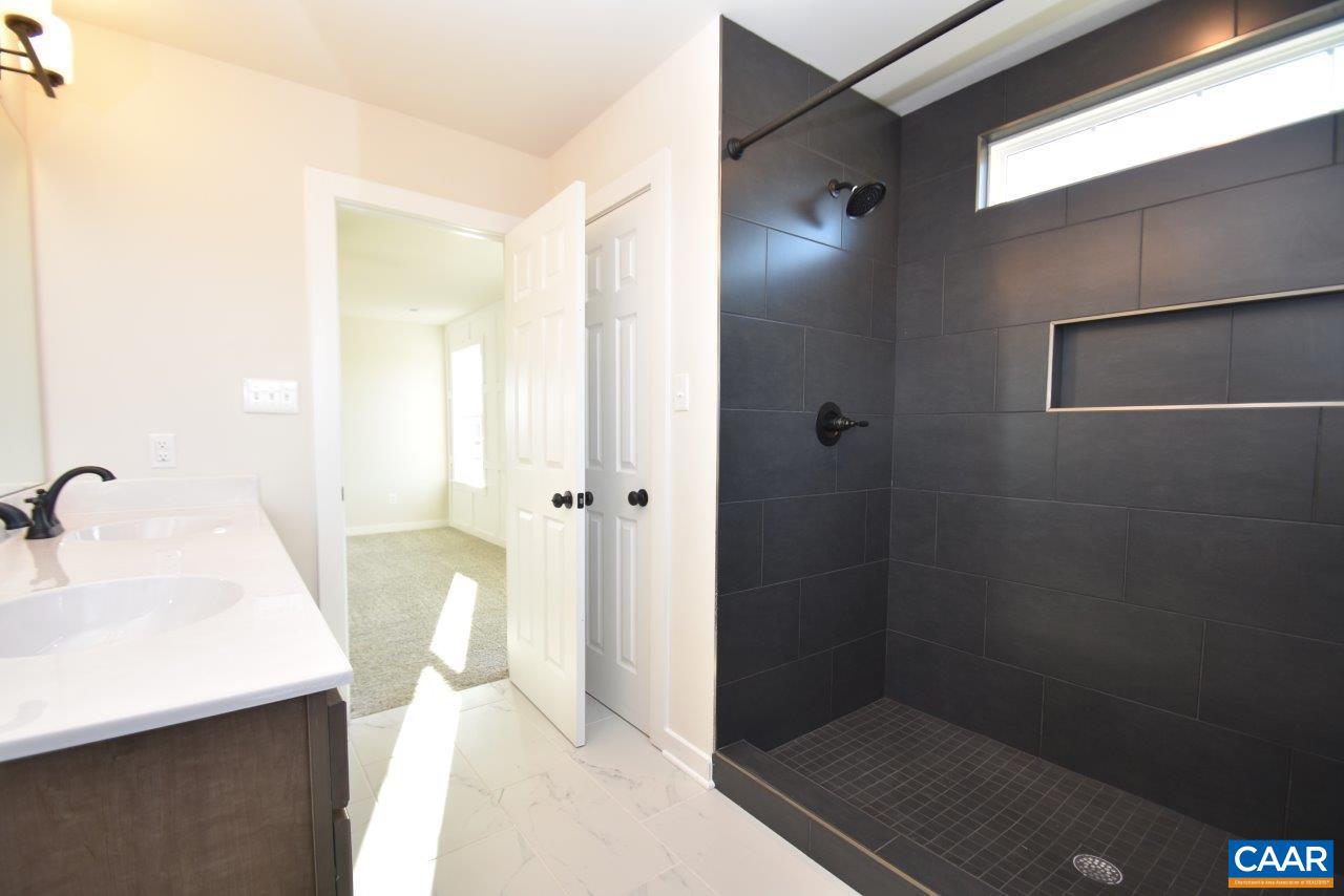 71 Riva Way Palmyra, VA 22963 - Photo 20 of 26 a bathroom with a sink and a mirror