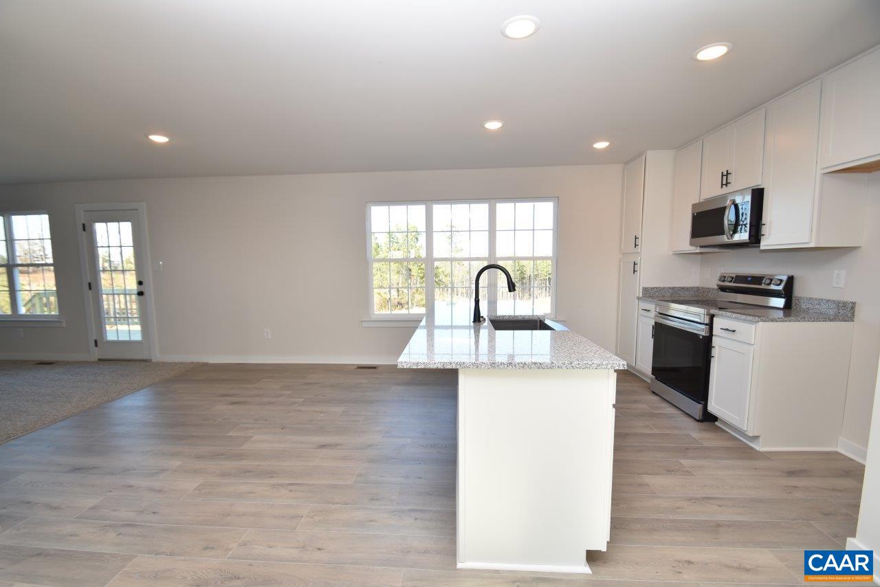 71 Riva Way Palmyra, VA 22963 - Photo 8 of 26 a kitchen with kitchen island a sink stainless steel appliances and window