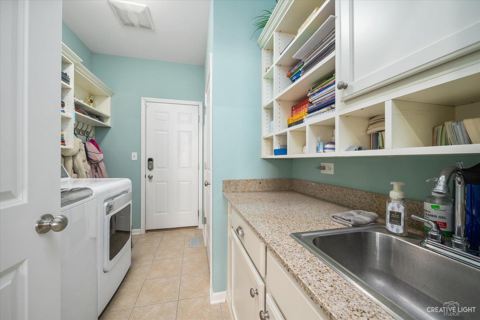 3521 English Prairie Road Elgin, IL 60124 - Photo 17 of 35 a kitchen with a sink and a refrigerator