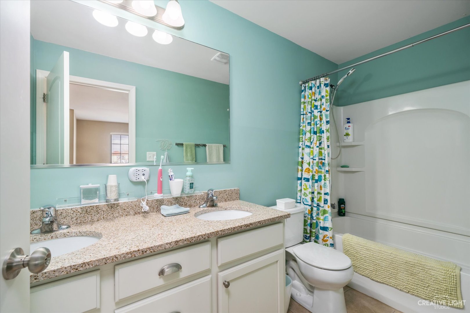 3521 English Prairie Road Elgin, IL 60124 - Photo 25 of 35 a bathroom with a granite countertop sink a toilet a mirror and shower