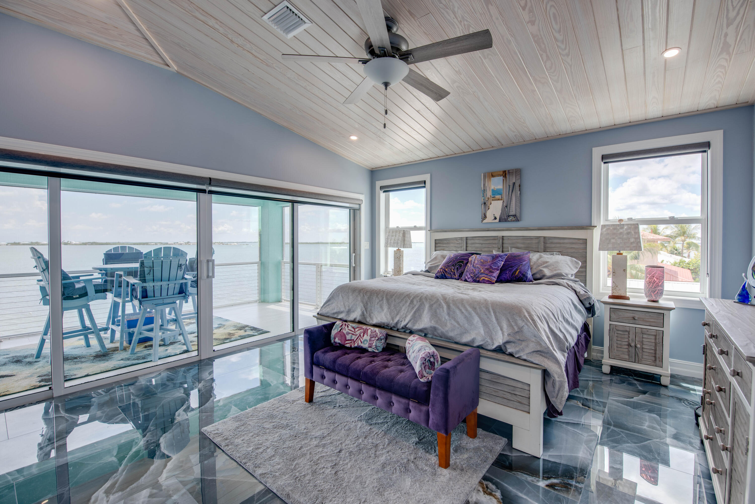 747 La Fitte Road Summerland Key, FL 33042 - Photo 83 of 103 a bedroom with a bed a table and chairs