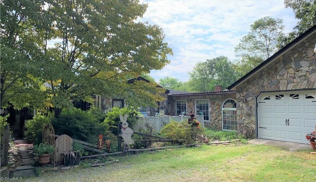 3208 Groometown Road Greensboro, NC 27407 - Photo 9 of 9 Beautiful Stone Work. Large 2 car garage with a breezeway to the main house.