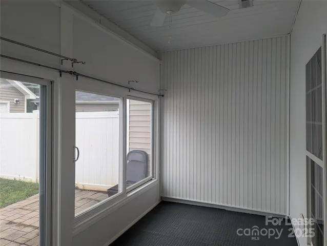 a view of a room that has a large window