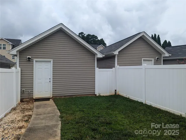 a view of a house with a yard and garage