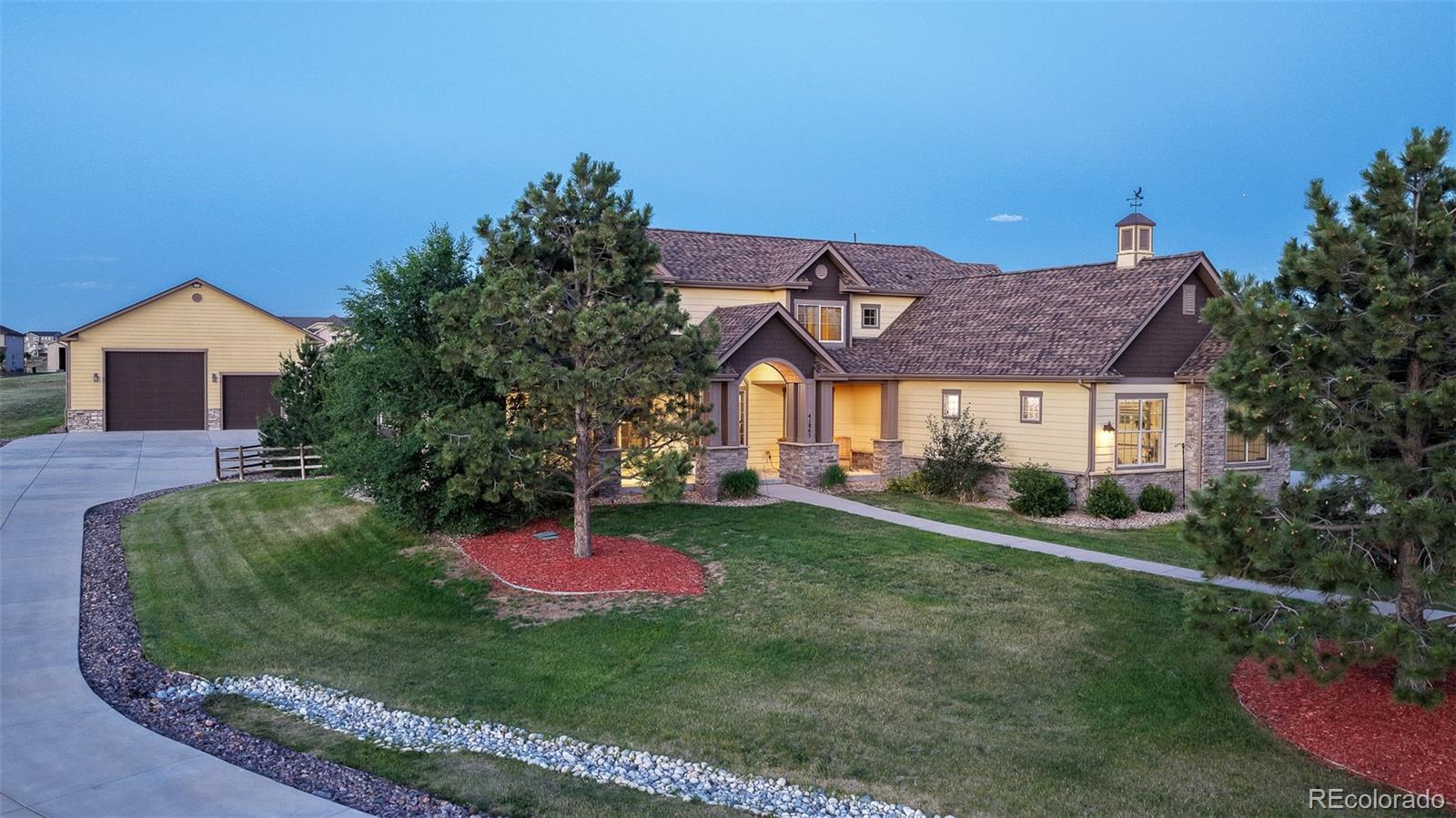 41865 East Muirfield Loop Elizabeth, CO 80107 - Photo 1 of 50 a front view of a house with a yard