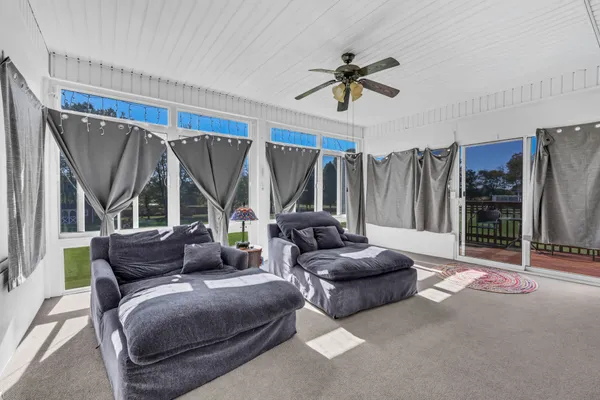 a living room with furniture and a window
