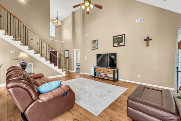 a living room with furniture and a flat screen tv